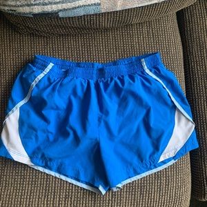 Blue Nike running shorts